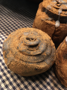 Blackened bees wax hand rolled Cinnamon Roll.