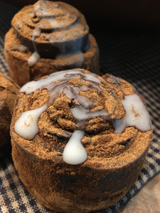 Blackened bees wax hand rolled Cinnamon Roll.